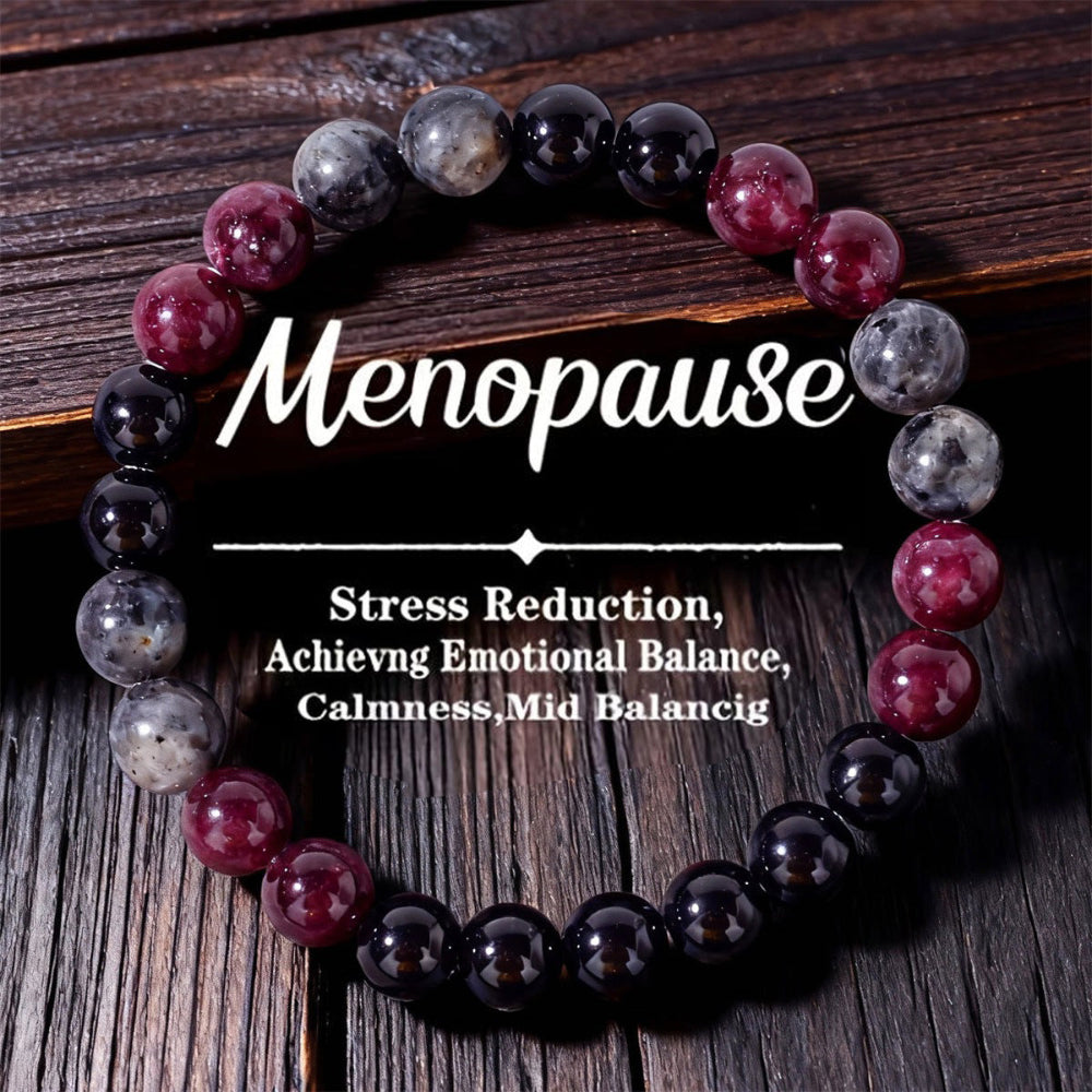 Natural Garnet Black Onyx Smoky Crystal Bracelet on a warm weathered wood surface, hand-strung with deep garnet red, smooth black onyx and translucent smoky beads
