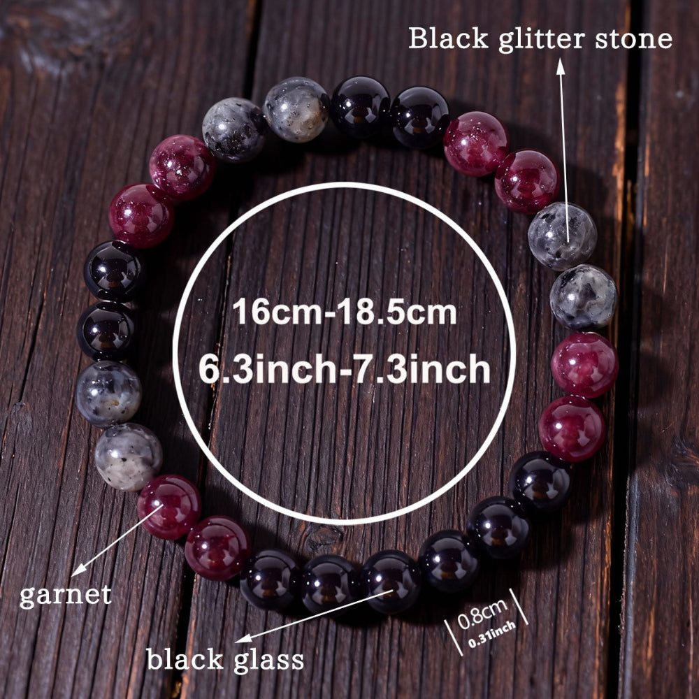 Natural Garnet Black Onyx Smoky Crystal Bracelet shown from a second angle, emphasizing the soft stretch cord loop and the calm three-color balance across the circle