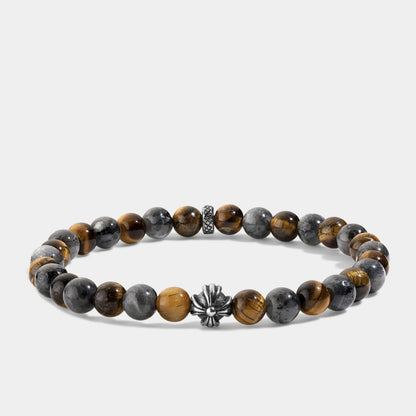 Natural tiger eye hawk eye stone bracelet showing two-color alternating beads — warm chatoyant tiger eye and cool blue-grey hawk eye with handcrafted silver accent beads on elastic cord.