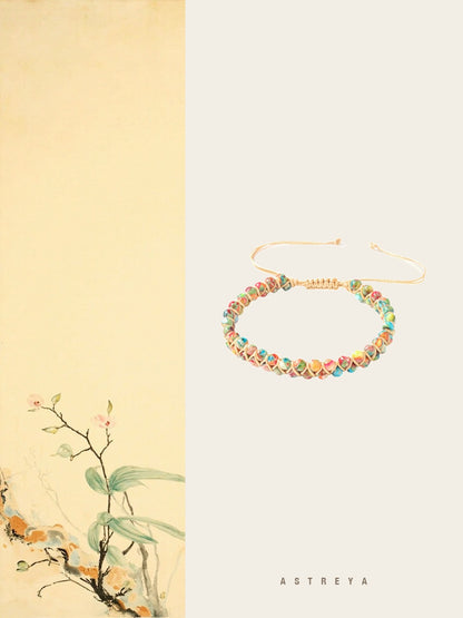 Multi-Color Gemstone Woven Bracelet hand-woven on golden cord with red, pink, amber, green, turquoise and ivory natural stone beads, adjustable pull-cord closure, vibrant crystal jewelry gift for women.