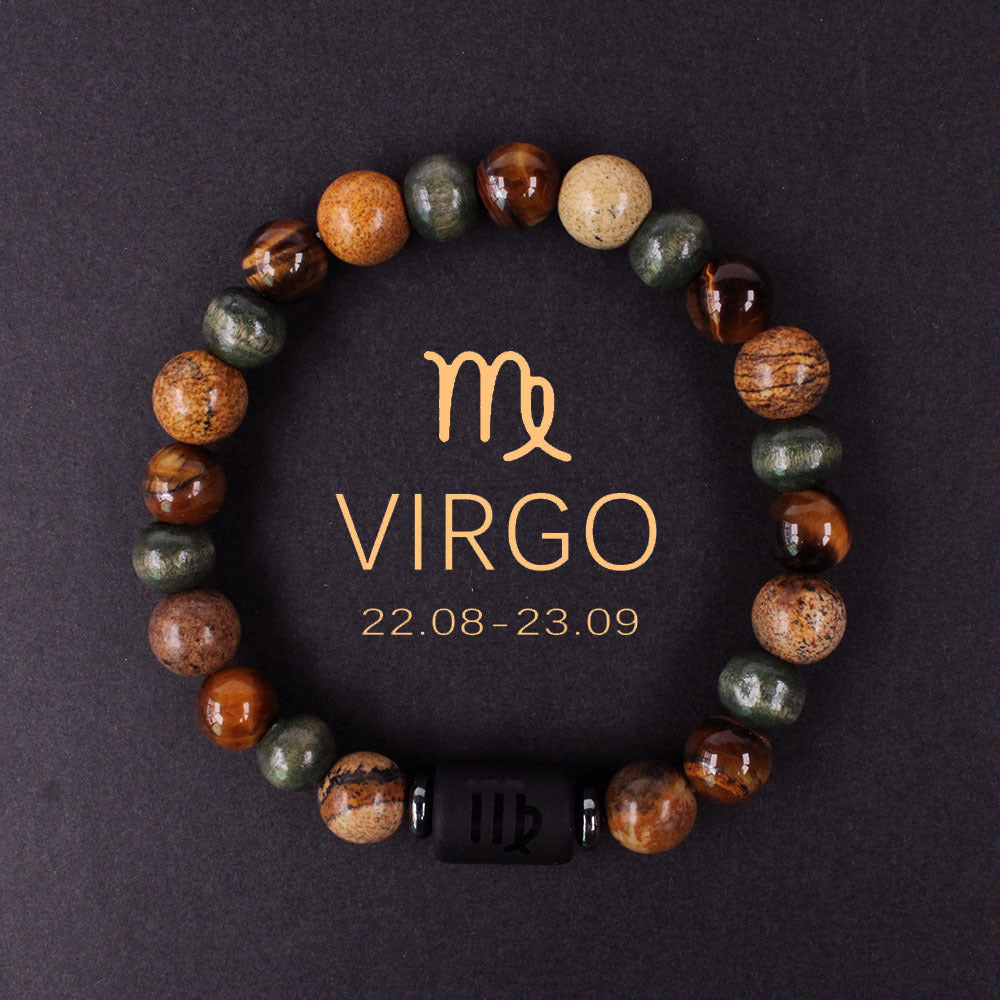Macro detail of natural zodiac stone bracelet engraved obsidian zodiac symbol centerpiece alongside chatoyant tiger eye and silky hawk eye natural stones, polished finish, soft daylight.