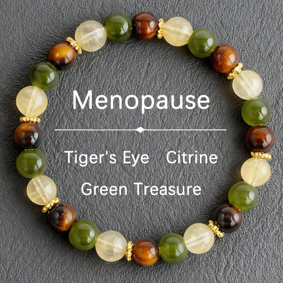 Natural tiger eye crystal stone bracelet showing three-color alternating beads — warm golden-brown chatoyant tiger eye, deep forest green stone and pale apple green translucent crystal on elastic cord