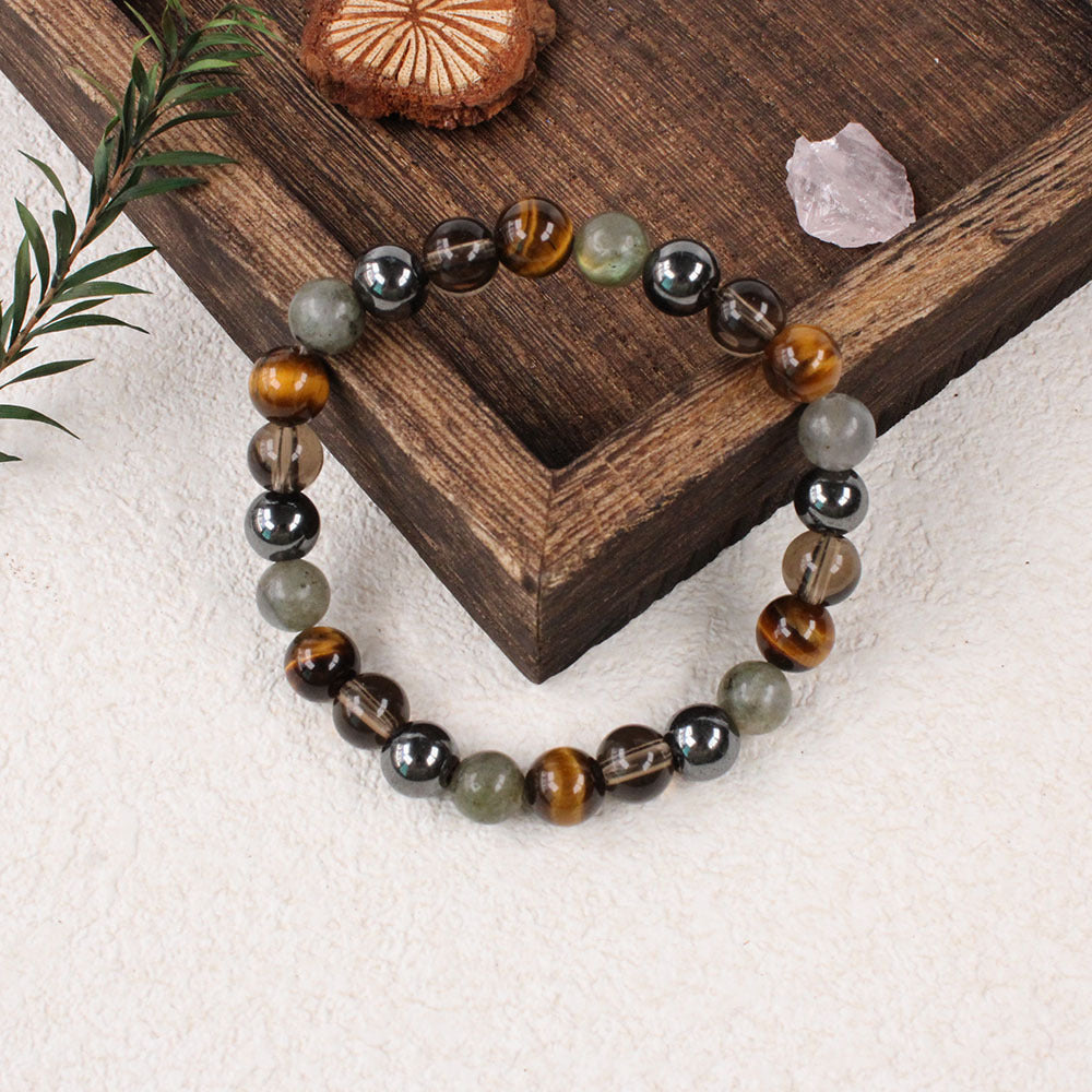 Natural Tiger Eye Black Onyx Labradorite Bracelet shown from a second angle, emphasizing the soft stretch cord loop and the calm three-color balance across the circle