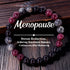 Natural Garnet Black Onyx Smoky Crystal Bracelet on a warm weathered wood surface, hand-strung with deep garnet red, smooth black onyx and translucent smoky beads