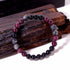 Close-up of Natural Garnet Black Onyx Smoky Crystal Bracelet, focusing on the trio of garnet red, black onyx and smoky inclusion beads sitting side by side
