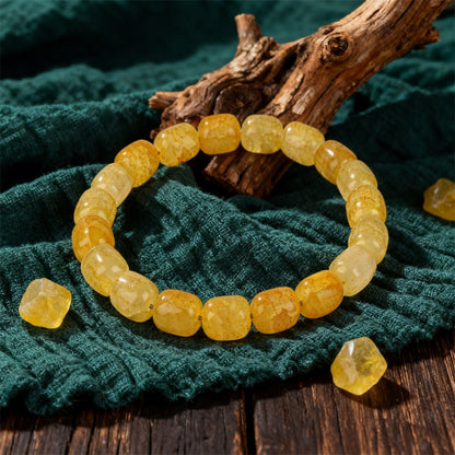 Natural Citrine Barrel Bead Bracelet shown from a second angle, emphasizing the soft stretch cord loop and the warm honey to amber shading across each barrel bead 