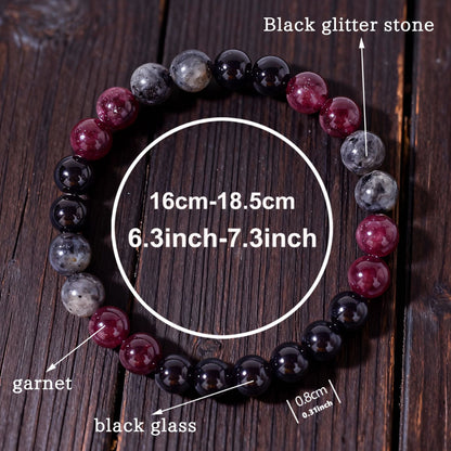 Natural Garnet Black Onyx Smoky Crystal Bracelet shown from a second angle, emphasizing the soft stretch cord loop and the calm three-color balance across the circle
