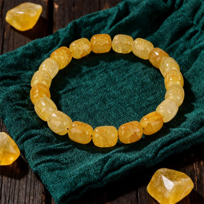 Close-up of Natural Citrine Barrel Bead Bracelet, focusing on the flat polished facets of the barrel-shaped citrine quartz beads catching afternoon light