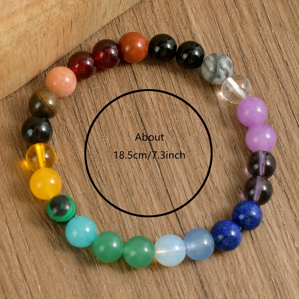 Multi-Color Natural Crystal Stone Bracelet resting beside a linen notebook on a wood table, styled as a quiet daily stacker for women who love natural stone jewelry 