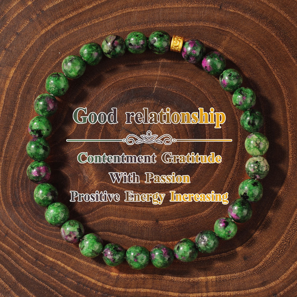 Natural Green Zoisite Ruby Bracelet shown from a second angle, emphasizing the soft stretch cord loop and the small gold charm sitting at the top of the circle
